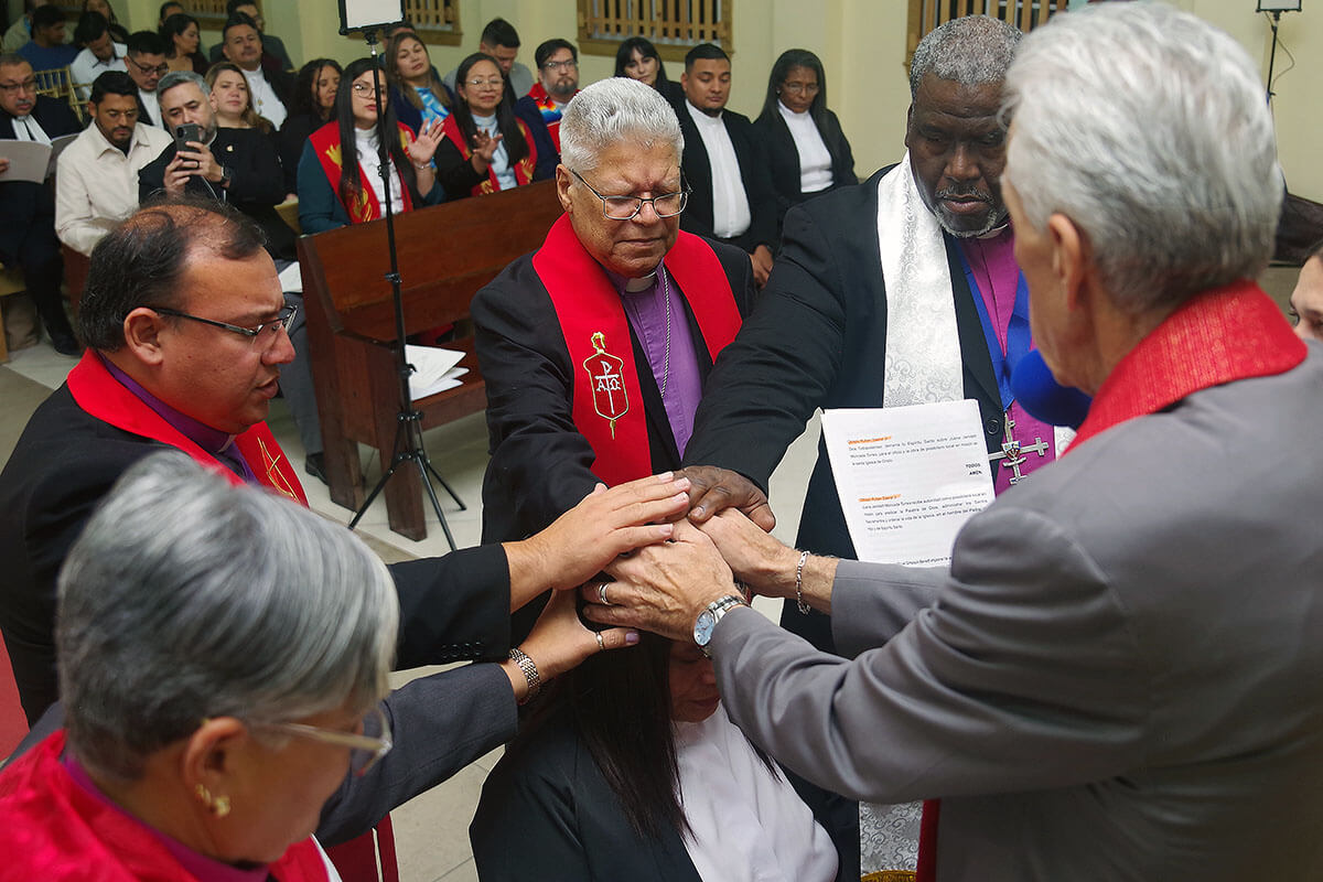 The United Methodist Mission in Honduras ordained its first three elders since its founding in 1997. In the photo, the bishops present lay hands on María Magdalena Zelaya Cruz. From left: Bishop Lizzette Gabriel Montalvo, Bishop Juan de Dios Peña, Bishop Emeritus José Roberto Peña Nazario, Bishop Juan Miguel Simpson Bennett, and Bishop Rubén Sáenz Jr. Photo by the Rev. Gustavo Vásquez, UM News.