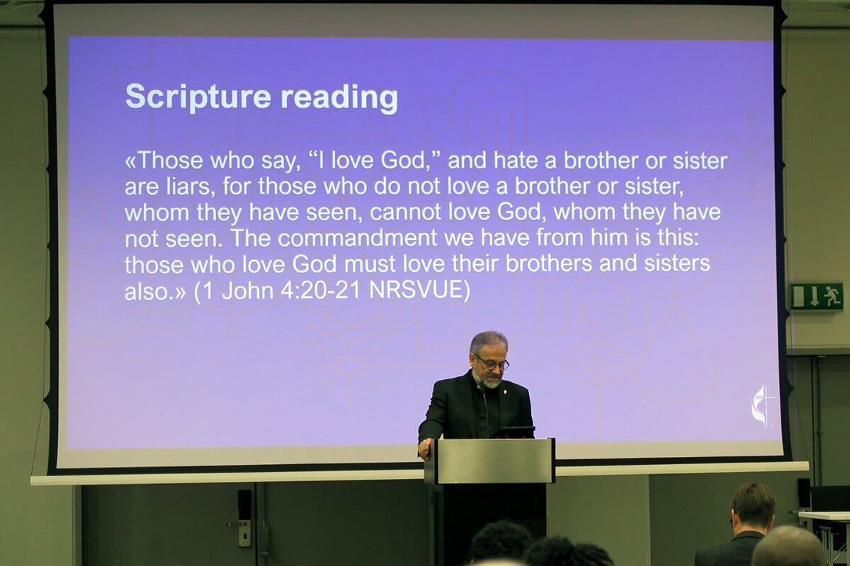 Bishop Harald Rückert recites 1 John 4:20-21 during opening worship for a Feb. 6-9 meeting in Copenhagen, Denmark, that brought together members of the Committee on Faith and Order, the Connectional Table, the Study of Ministry Commission and the Standing Committee on Regional Conference Matters Outside the USA (previously the Standing Committee on Central Conference Matters). Rückert, who has retired after leading The United Methodist Church in Germany, chairs the standing committee that is leading the work to develop a globally relevant Book of Discipline. Photo by Heather Hahn, UM News.