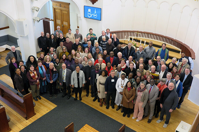 All the United Methodist leaders meeting in Denmark stand for a group photo after worship at Jerusalem United Methodist Church in downtown Copenhagen. Photo by Heather Hahn, UM News.