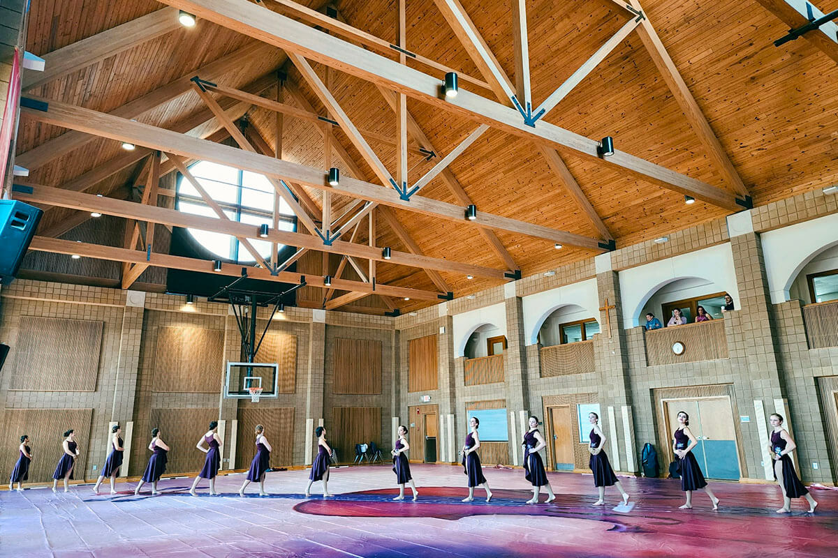 Members of the Decatur High School Varsity Winter Guard from Decatur, Georgia, practice in the gym at St. John’s United Methodist Church in Rock Hill, S.C., ahead of the Winter Guard International Southeastern Regional Championships on March 1. Photo by Michelle Zoss.