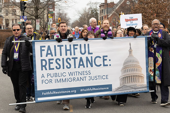 United Methodists and other faith leaders march toward the U.S. Capitol during “Faithful Resistance: A Public Witness for Immigrant Justice” in Washington on Feb. 25. Holding the left end of the banner is Bishop Héctor Burgos Núñez. At right is Bishop Julius C. Trimble. Photo by Mike DuBose, UM News.