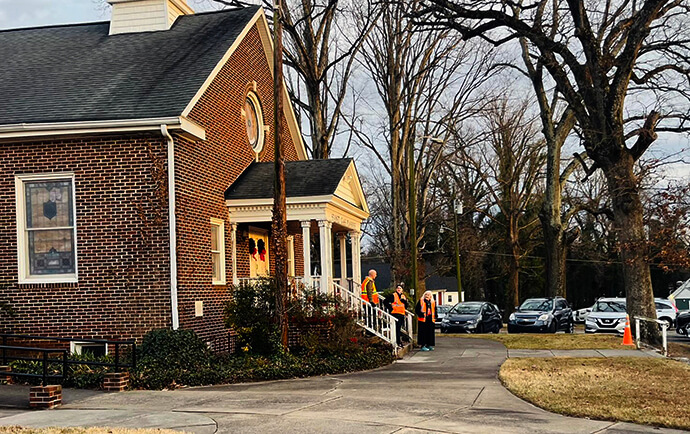 Volunteers keep watch for Immigration Customs and Enforcement agents while the congregation of Marvin United Methodist Church, also known as Comunidad de Gracia, worships in Winston-Salem, N.C. The church is largely a Hispanic congregation. Photo courtesy of Marvin United Methodist Church. 