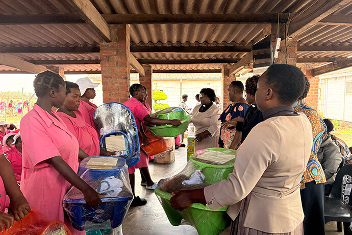 Expectant mothers at Chikurubi Female Prison in Harare, Zimbabwe, receive baby welcome packs from United Methodist pastors from the Chitungwiza Marondera District. The women welcomed the gesture of love extended by the church as some did not have basic clothing, diapers and other supplies for their babies. Photo by Eveline Chikwanah, UM News.