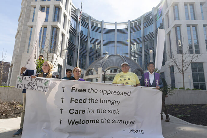 Faith leaders lead a litany outside the Fred D. Thompson Federal Building in Nashville, Tenn. 