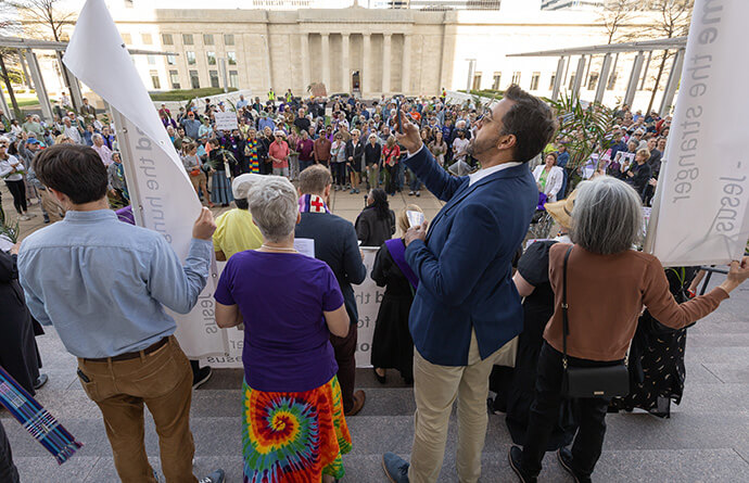 Leaders of a Palm Sunday Witness gather on the steps of the William Snodgrass Tennessee Tower Plaza in Nashville, Tenn.