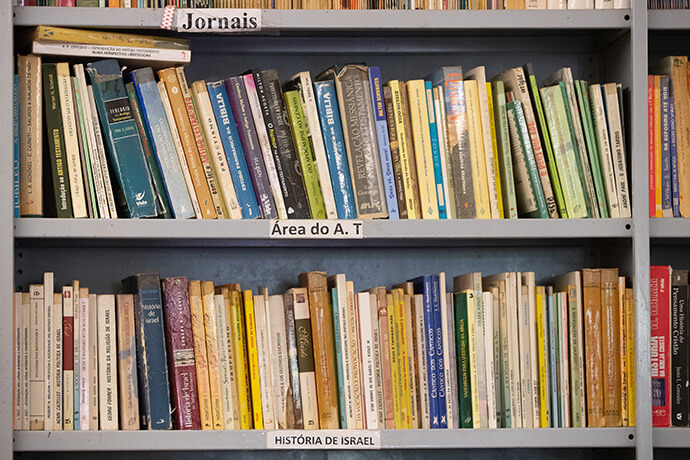 Well-used books line library shelves at the Cambine Theological Seminary, part of the United Methodist Cambine Mission near Macarringue, Mozambique. Cambine Theological Seminary is among more than 20 United Methodist-related theological schools outside the U.S. File photo by Mike DuBose, UM News. 