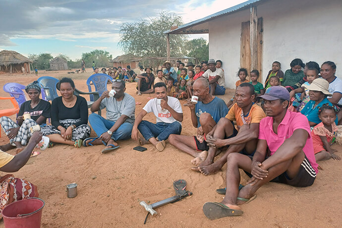 United Methodist evangelists share a drink in Ankilimidega, Madagascar, one of several locations they visited in the southern part of the island nation. The team conducted open-air campaigns and house-to-house outreach in communities where there had never been a church and Christianity was new to many. Photo by Tinasoa Tsimanavaka, UM News. 