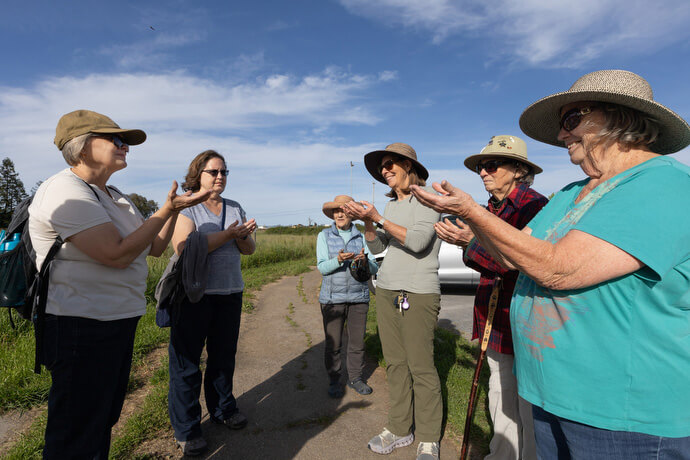 Santa Rosa trail. Participants in a Sacred Ground field trip hike through grassland on the Laguna de Santa Rosa trail near Sebastopol, Calif. 