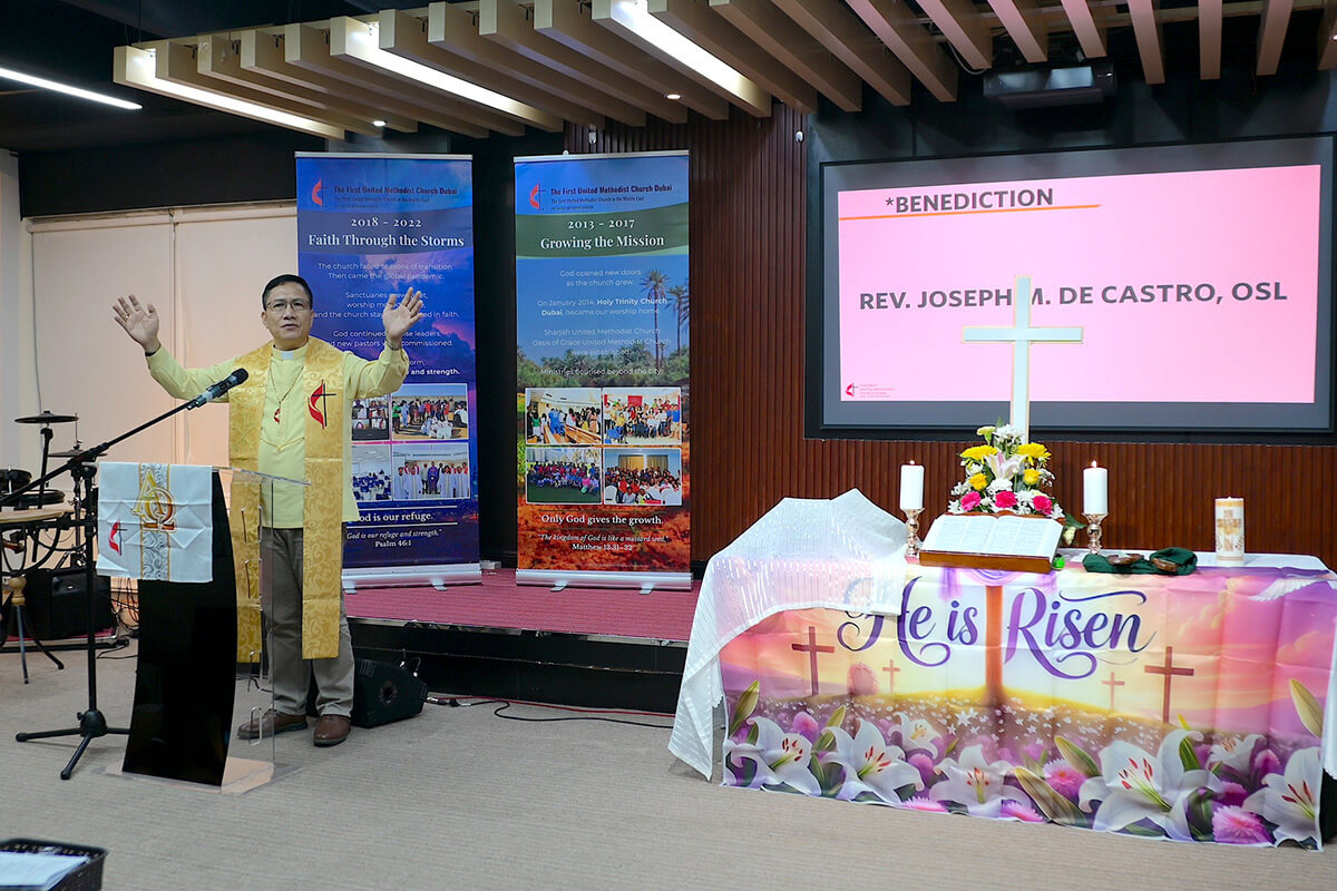 The Rev. Joseph M. De Castro, pastor at First United Methodist Church in Dubai, delivers a benediction at the Hamarin Center, a venue in Daira, Dubai, that the congregation rented while places of worship in the country were temporarily closed as a safety precaution during the U.S.-Israel war with Iran. His congregation of mostly migrant workers met by Zoom on Easter Sunday. Photo courtesy of the TFUMC Dubai Media Team. 