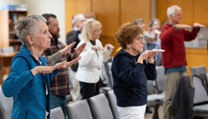 Parishioners stretch before the sermon at Windsor Community United Methodist Church in Windsor, Calif. 