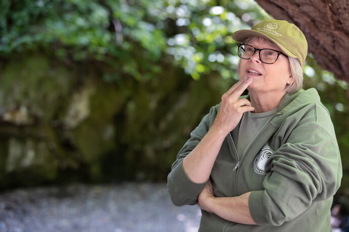 The Rev. Laurie Bayen leads a reflection on the lives of Native Americans and asks hikers to recite their names near a waterfall at Sugarloaf Ridge State Park in Kenwood, Calif. 