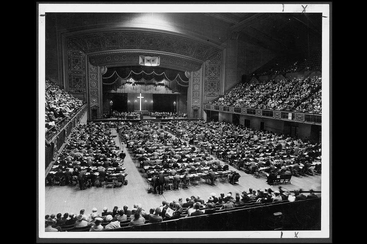 The Methodist Church’s 1956 General Conference meets from April 25 to May 7 in the municipal auditorium in Minneapolis. On May 4, the first Friday of the legislative assembly, the delegates voted to make women eligible for full clergy rights. “Now it is up to us to prove in clear and deep witness to the whole church our consecration and our loyal devotion to the work of the Kingdom of God,” said Margaret Henrichsen, a General Conference visitor, after the vote. In 1967, she became the first U.S. woman appointed district superintendent. Photo courtesy of Archives and History. 