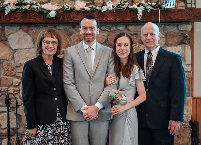Bishop Debra Wallace-Padgett poses with her family at her son’s April 2026 wedding. From left are Wallace-Padgett, son Andew Padgett, daughter Leanndra Thompson and husband Lee Padgett. Thompson says her mother “does a lot of juggling in order to prioritize the family.” Photo by Kaitlin Turner.