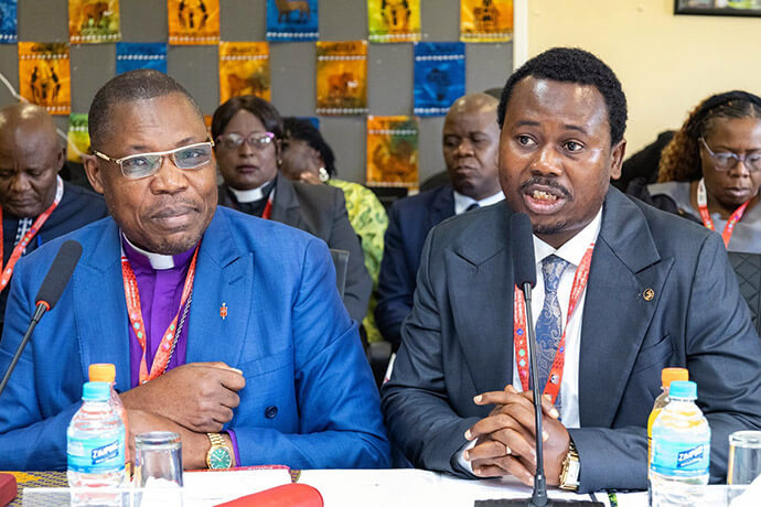 Bishop Daniel O. Lunge (left) of Central Congo is the new chair of the Africa University board. Lunge has been a university professor since 2012. At right is the Rev. Fiston Okito (right), Central Congo communications director, who provided translation during the meeting. Photo courtesy of Africa University Advancement and Public Affairs Office.
