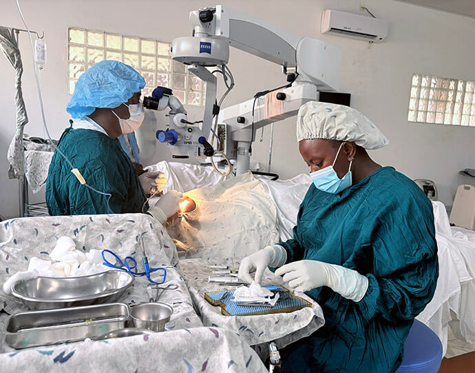 Dr John G. Mattia (in blue cap), the only pediatric ophthalmologist in Sierra Leone, performs a cataract removal surgery at the Lowell and Ruth Gess United Methodist Church Eye Hospital there. About 50% of the hospital’s patients are from neighboring Guinea and Liberia. Photo by Eveline Chikwanah, UM News.