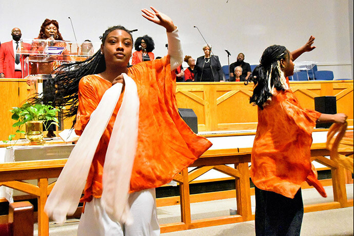Dallas high school students dance during a performance of “Gospel Mass” as the Rev. Cynthia Wilson and choir members sing May 2 at Hamilton Park United Methodist Church in Dallas. Photo by John W. Coleman, UM News.