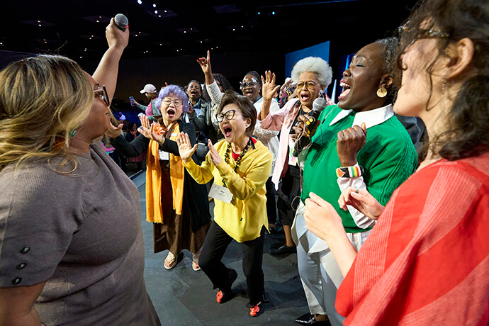 Following a final communion service on May 17, women celebrate the conclusion of the United Women in Faith Assembly in Indianapolis. Photo by Paul Jeffrey, United Women in Faith.
