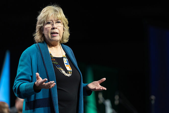Jana Jones, president of United Women in Faith, addresses the group’s 2026 Assembly in Indianapolis. Photo by Mike DuBose, United Women in Faith.