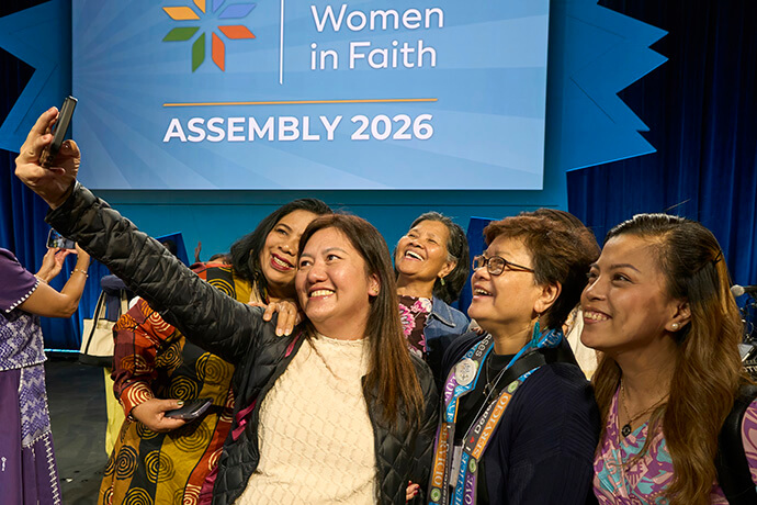 Following a final communion service on May 17, women take photos of themselves and their friends at the conclusion of the United Women in Faith Assembly in Indianapolis. Photo by Paul Jeffrey, United Women in Faith.