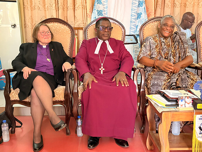 Retired Bishop Rosemarie Wenner of Germany and the Most Rev. Paul K. Boafo, Africa Methodist Council president, pose for a photo with the regent His Royal Highness Adondjégoun Latévi Lawson-Body at the Lolan Royal Palace in Aného, Togo.  The visit was conducted after worship service, which the regent attended May 17 at Ebenezer Temple. Photo by Eveline Chikwanah, UM News.