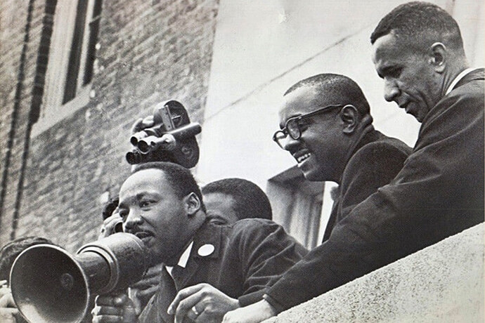 The late Rev. Gilbert H. Caldwell (right), a United Methodist pastor, stands with the Revs. Martin Luther King Jr. (left) and Virgil Wood on the roof of a Boston public school in 1965. A 19-year-old Clara Ester was present when King was assassinated on April 4, 1968, at the Lorraine Motel in Memphis, Tenn., and ran to his assistance. Photo courtesy of the Rev. Gilbert H. Caldwell.