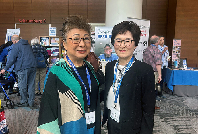 The Rev. Misook Park (right) and Hae S. Shin, chair of the Sammool House board, attend the Northern Illinois Annual Conference on June 14, 2026. "We're not simply giving people a place to stay," Shin said. "We're helping them move forward." Photo by the Rev. Thomas E. Kim, UM News.