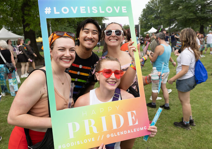 Attendees of the Nashville Pride Festival pose with a picture frame provided by Glendale United Methodist Church. Clockwise from left are Sydney Shansey, Zijian Peng, Nicole Drinkwater and Ashlyn Cianciolo.