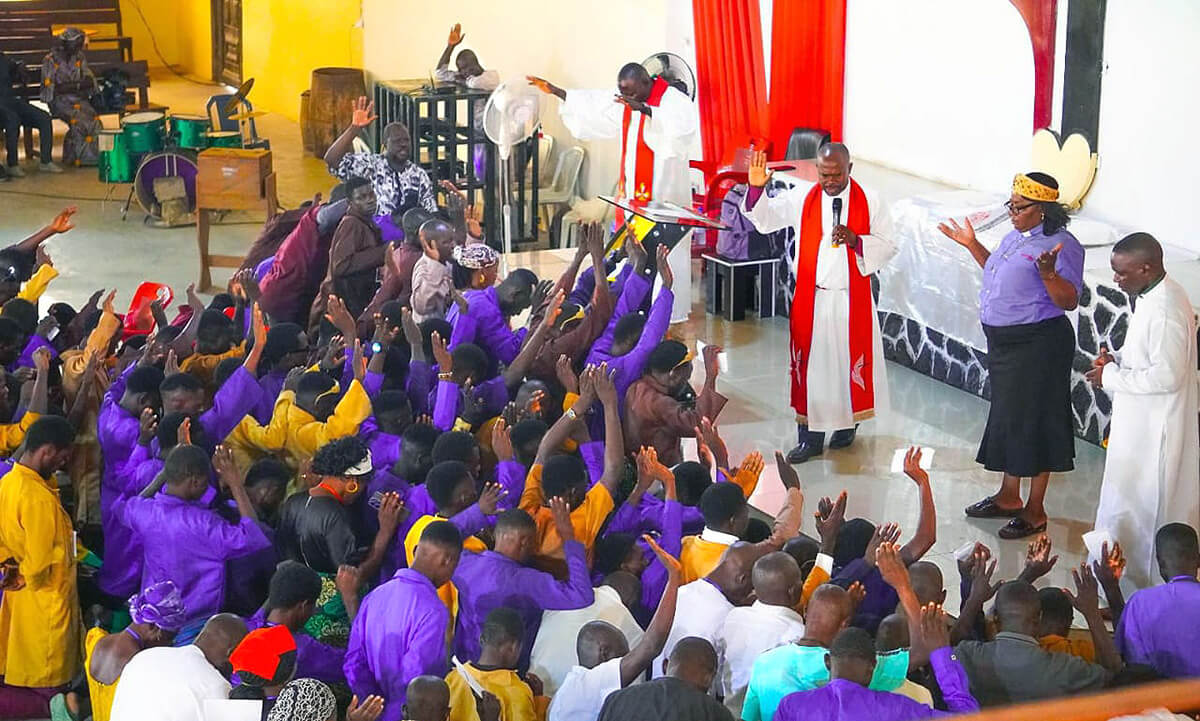 Bishop Ande I. Emmanuel (right center) prays for graduates of The United Methodist Church’s Technical Training Program during a July 1 ceremony in Jalingo, Nigeria, marking the program’s revival after a two-decade hiatus. Seventy-eight trainees graduated the vocational program with skills in electrical installation and welding fabrication. Photo by Joseph Dauda Idris, UM News. 