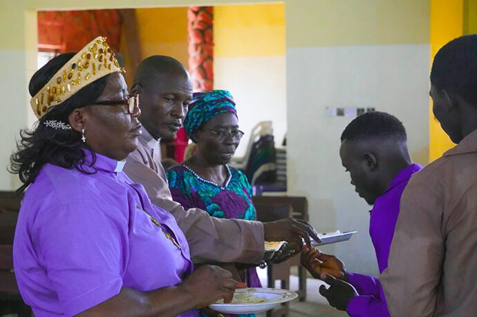 The Rev. Gloria Iliya Dogara (left), the bishop’s administrative assistant for the Southwest Nigeria Conference, participates in a liturgical service during a ceremony honoring Technical Training Program graduates. Photo by Joseph Dauda Idris, UM News. 
