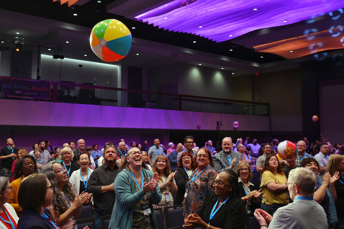 Participants toss beach balls around in a time of fellowship during the SCD 2026 — RISE UP: Love, Serve, Lead conference, held Aug. 2-5 at the Hyatt Regency in Columbus, Ohio. Discipleship Ministries’ biennial event help equip clergy and lay leaders to plant, revitalize and innovate local churches. Photo by Scott Hughes, Discipleship Ministries. 