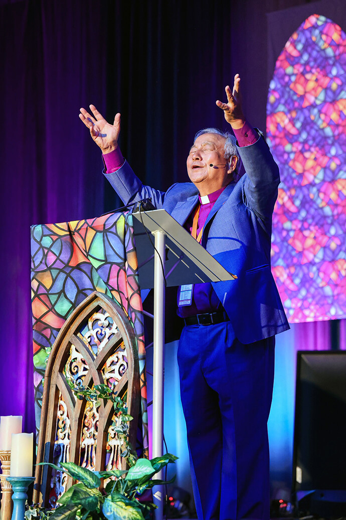 Bishop Hee-Soo Jung, who leads the Ohio Episcopal Area where the conference was held, prays over participants. Photo by Kenzie Gaus, West Ohio Conference. 
