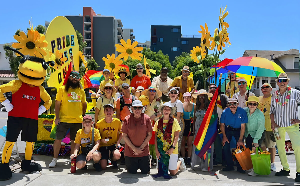 Members of Pacific Beach United Methodist Church in San Diego, led by the Rev. Lori Leopold (kneeling in stole), pose for a photo during the 2026 San Diego Pride Parade. Photo courtesy of Tammy Evans.