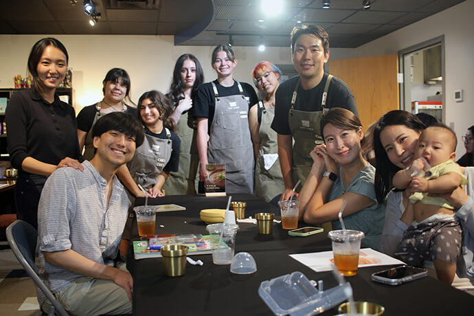 Through The Table Korean Cuisine, Bonfire United Methodist Church uses food and hospitality to build relationships beyond the church walls. The Rev. Changhyun Kim (back right), pastor and chef, poses with staff and church members. Photo by the Rev. Thomas E. Kim, UM News.