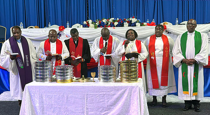 Clergy consecrate the elements for Holy Communion during the Chiringanyanza Revival in Blackpool, England. The United Methodist Church’s United Kingdom District started off as a mission area with one pastor and now has 12 pastors serving more than 4,000 members. Photo by Priscilla Muzerengwa, UM News.