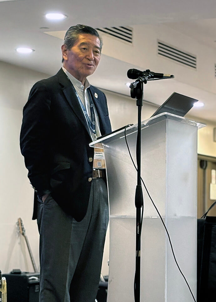 Humberto Martín Shikiya addresses the World Methodist Council after receiving the council’s 2026 Peace Award at a banquet on Aug. 14 in San Salvador, El Salvador. Shikiya, a member of the Evangelical Methodist Church in Argentina, was recognized for his work on behalf of the World Council of Churches in the peace process of Colombia. The South American country has endured a conflict that has lasted more than 60 years. Photo by Heather Hahn, UM News.