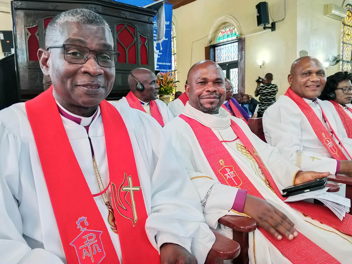 Bishops Gaspar J. Domingos, Ande I. Emmanuel and Nelson Kalombo Ngoy follow proceedings during the Africa College of Bishops opening worship service held at First United Methodist Church in Monrovia, Liberia. The church, which was built in 1822, is the oldest Protestant church in Africa. Photo courtesy of Liberia Annual Conference Communications.