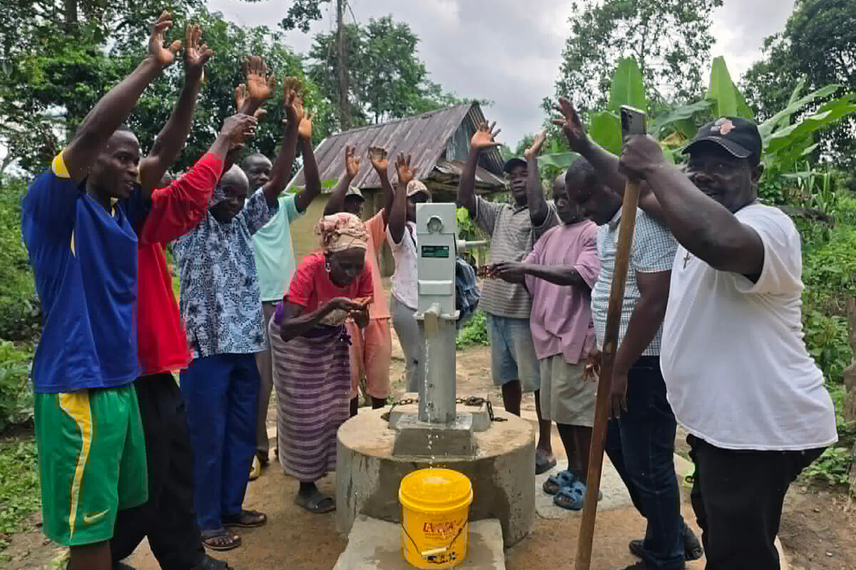 Members of Bartee Pannoh United Methodist Church and community members celebrate during the dedication of a water well in the Karquekpo community in Sinoe County, Liberia. As part of its most recent outreach, the Liberia Conference provided 25 water wells, 15 gender-sensitive toilets and poly tanks to harvest rain water in rural communities where the church is present. Photo courtesy of the United Methodist Human Rights Monitor. 