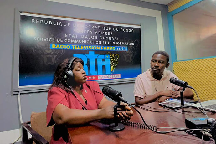 Judith Yanga Osongo (left), director of communications for the East Congo Episcopal Area, takes part in a radio program at a studio in Bunia, Congo, to broadcast Ebola prevention messages. The appearance is part of The United Methodist Church’s media campaign to counter misinformation and effectively reach communities isolated from the outbreak's epicenter. Photo courtesy of the East Congo Episcopal Area.