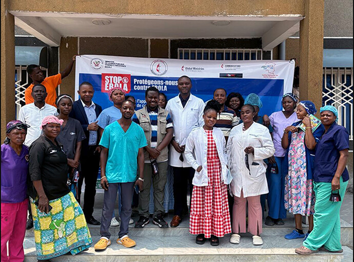 The Rev. Fiston Okito (center in striped shirt), director of communications for the Central Congo Episcopal Area, poses alongside medical staff at Kimbwala Methodist Hospital Center in Kinshasa, Congo. The meeting is part of United Methodist efforts to mobilize medical facilities and church leaders to spread prevention messages and counter misinformation about Ebola. Photo courtesy of the Central Congo Episcopal Area.