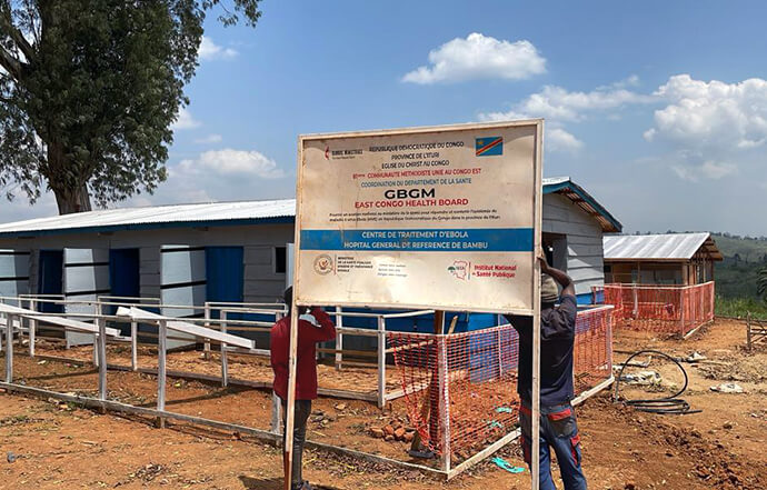 A sign for a United Methodist Church-supported Ebola treatment center is installed at the construction site at Bambu General Referral Hospital in the Djugu territory in Ituri, Congo. Funded by a $100,000 grant from the United Methodist Board of Global Ministries’ Global Health unit, the new health facility will have a capacity of 50 beds to isolate and quickly treat patients and reduce community transmission at the epicenter of the outbreak. Photo courtesy of the East Congo Health Board. 