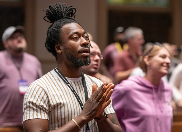 Vincent Hale (front) joins in singing during closing worship for the Fusion 2026 Worship Music Conference. Hale is worship leader at East Ridge United Methodist Church in Chattanooga, Tennessee.