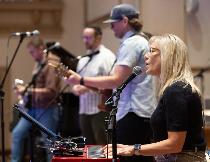 Kiersten Rose (front) plays keyboard with the praise band during the Fusion 2026 Worship Music Conference. Rose is director of operations for the Institute for Modern Worship.