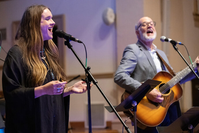 Acoustic folk duo Kat Dambrino and Ned Henry sing during the Fusion 2026 Worship Music Conference.