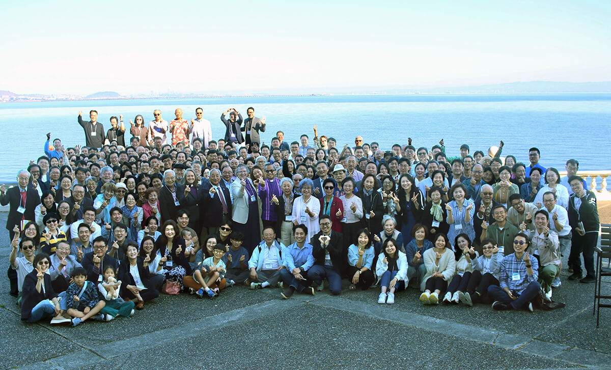 Participants in the Korean Association of The United Methodist Church’s 50th anniversary convocation pose with San Francisco Bay behind them after morning worship Oct. 6. The theme of the Oct. 5-8 gathering in Burlingame, Calif., was “Encounter, Engage, Empower.”
