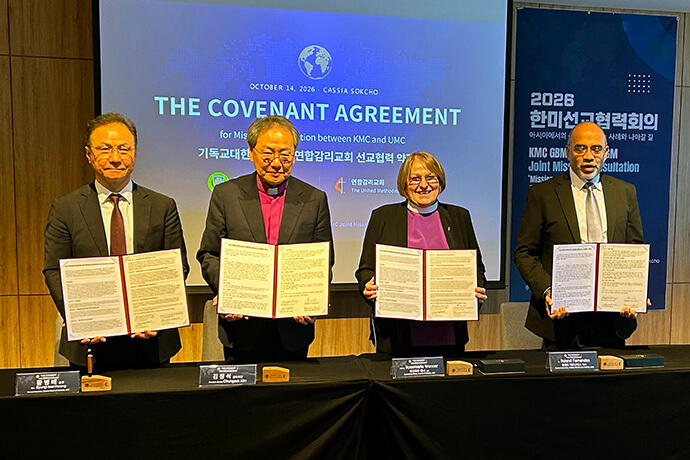 From left, the Rev. Byung-bae Hwang, Korean Methodist Bishop Chungsuk Kim, United Methodist Bishop Rosemarie Wenner and Roland Fernandes mark the signing of a mission cooperation covenant Oct. 14 in Sokcho, South Korea. Photo by the Rev. Thomas E. Kim, UM News.