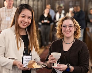Charmaine Narvadez (left) and Lijah Medina offer Holy Communion on Oct. 23 during the United Methodist Leadership Gathering at Knox United Church in Calgary, Canada. Photo by Mike DuBose, UM News.