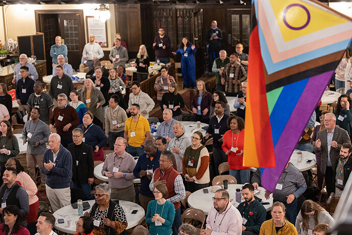 Attendees stand and sing during worship on Oct. 23 at the United Methodist Leadership Gathering at Knox United Church in Calgary, Canada. The church, which is hosting the international event, is an Affirming congregation, which welcomes LGBTQ people and their families. Photo by Mike DuBose, UM News.