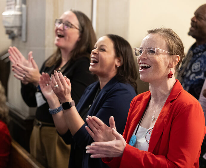 Church leaders sing during morning worship Oct. 23 at the United Methodist Leadership Gathering at Knox United Church in Calgary, Canada. From right are Ashley Boggan and the Revs. April Casperson and Meredith E. Hoxie Schol. Photo by Mike DuBose, UM News.